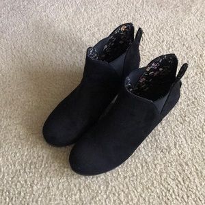 Ladies black wedge booties.